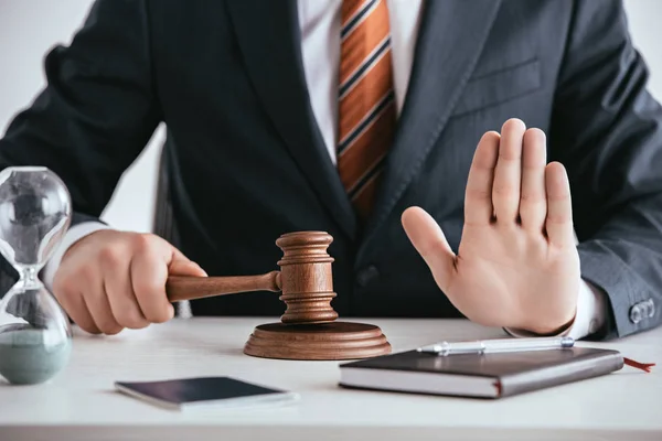 depositphotos_236486100-stock-photo-cropped-view-judge-suit-holding